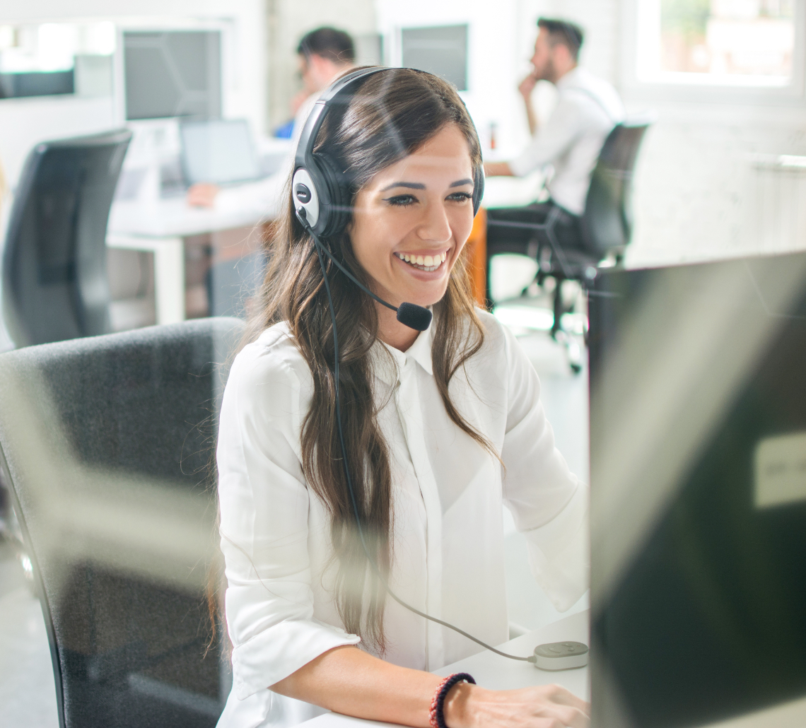 smiling lady talking on headset phone