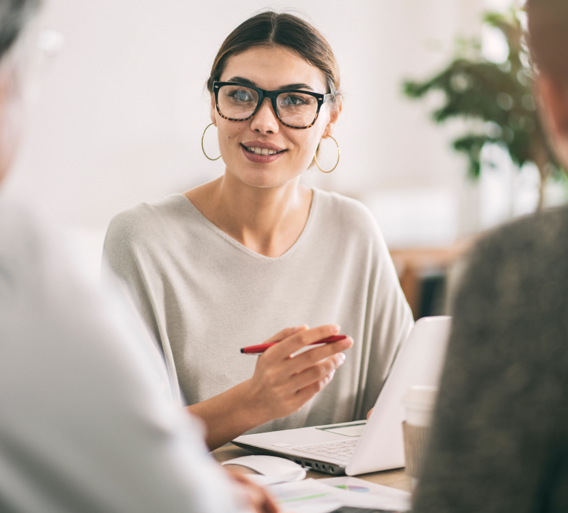 Lady smiling working on a computer